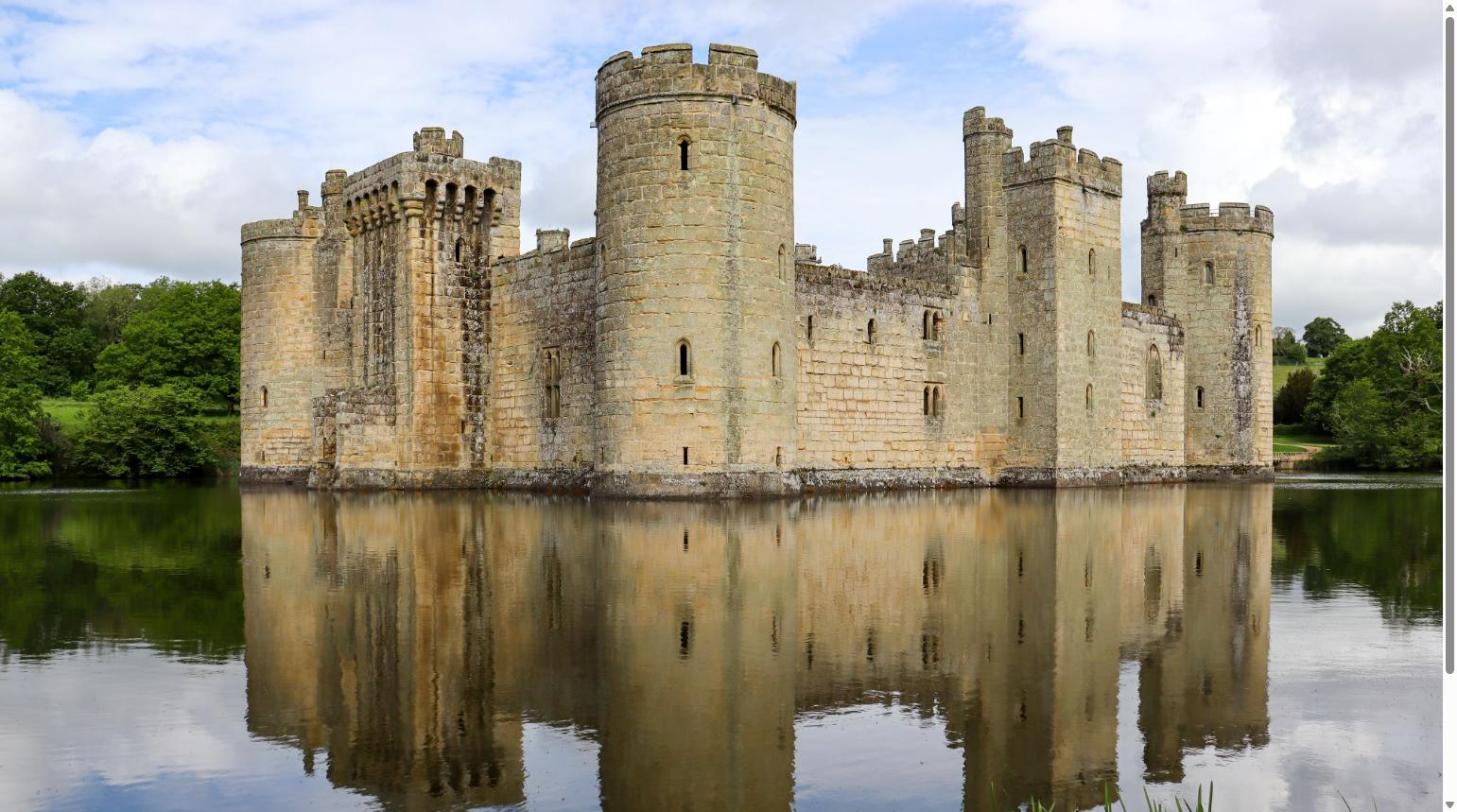 Bodiam Castle in May, East Sussex, with moat reflection